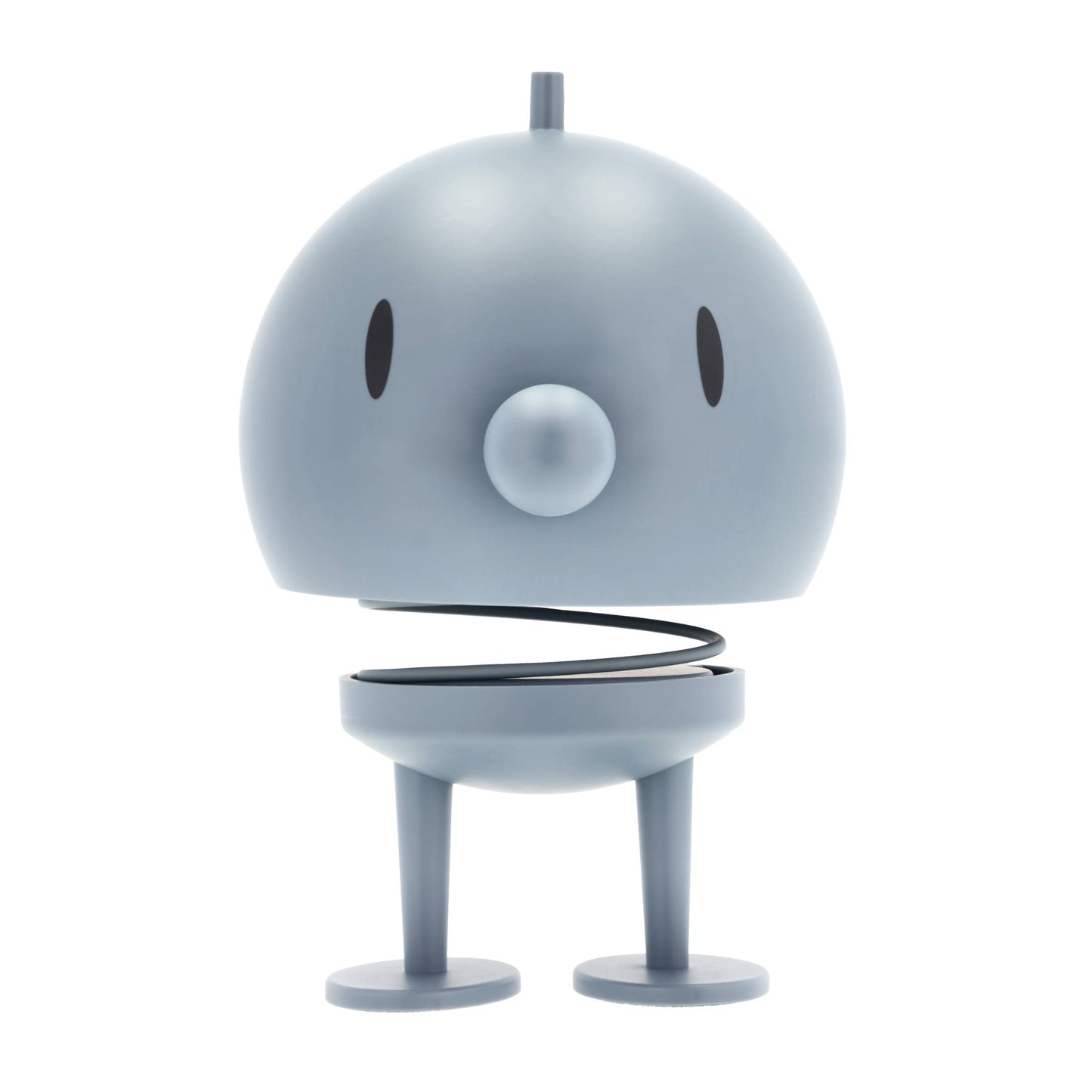 Small robot toy with a round body and legs on a white background