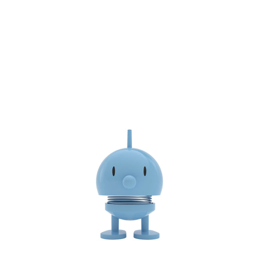 Small blue robot toy on a white background